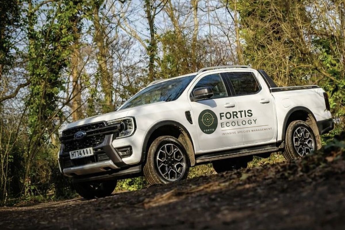 Fortis Ecology branded vehicle on site in woodland